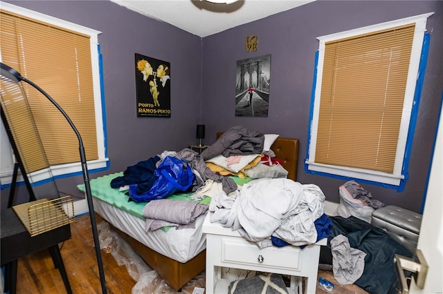 bedroom with wood finished floors