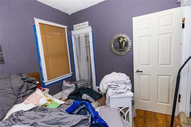 bedroom with wood finished floors