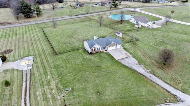 birds eye view of property featuring a rural view