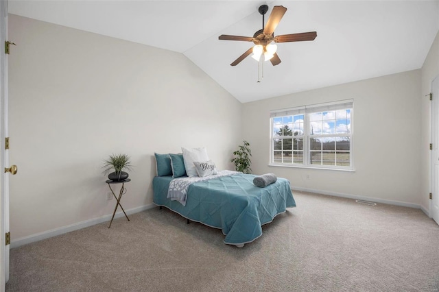 bedroom featuring lofted ceiling, carpet, and baseboards