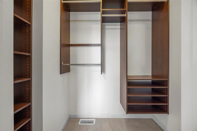 spacious closet featuring carpet floors and visible vents