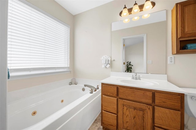 full bath featuring vanity and a whirlpool tub