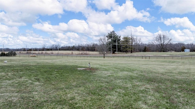 view of yard with a rural view