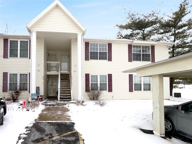 townhome / multi-family property featuring stairs