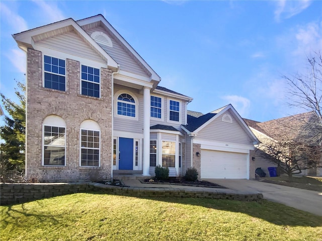 view of front of house with a garage, a front lawn, concrete driveway, and brick siding