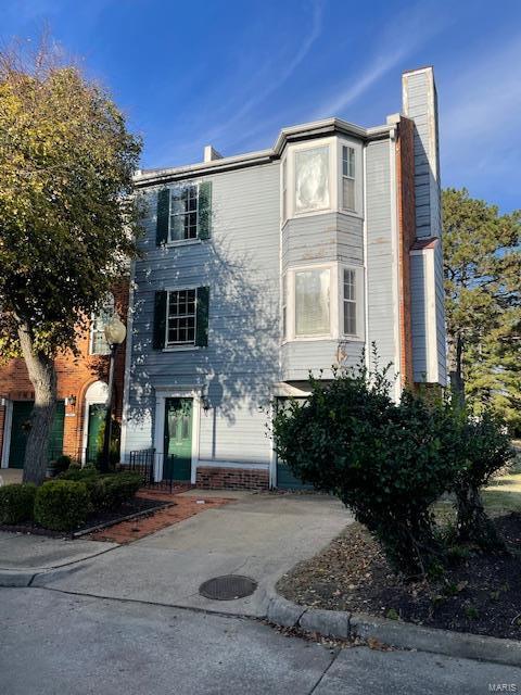 view of front of property with a chimney