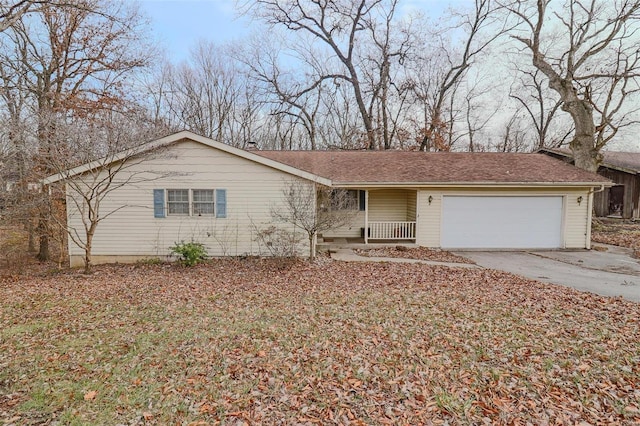 ranch-style house with an attached garage, driveway, and roof with shingles