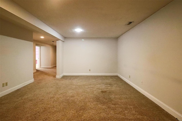 finished below grade area with recessed lighting, visible vents, baseboards, and carpet flooring