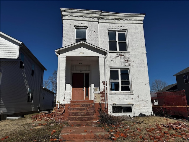 view of front of house with brick siding