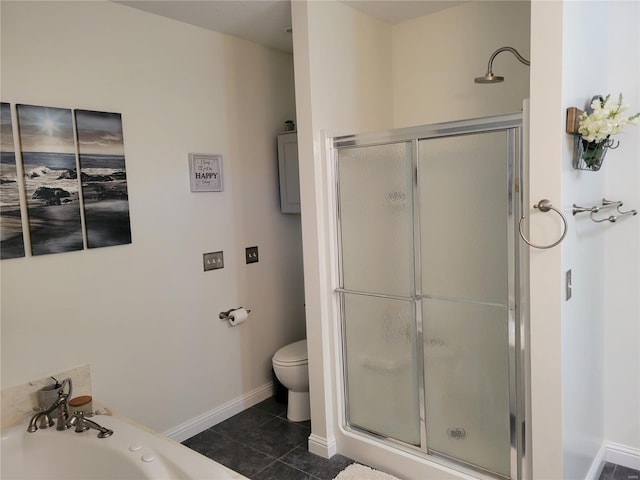 bathroom featuring a stall shower, tile patterned flooring, a garden tub, and toilet