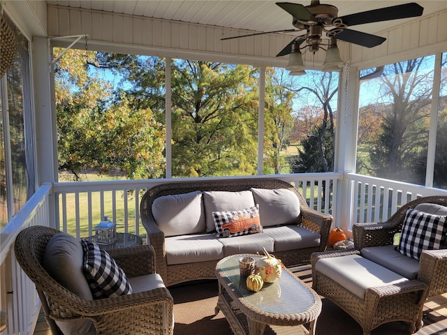 sunroom featuring a ceiling fan