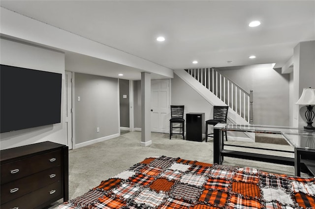 living room featuring recessed lighting, light carpet, stairway, and baseboards