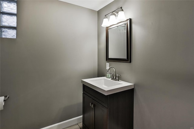 bathroom featuring baseboards and vanity