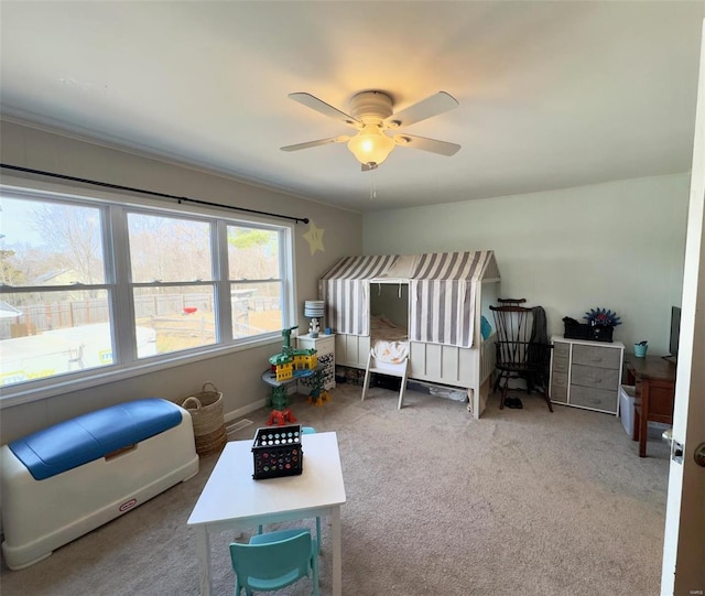 carpeted bedroom with ceiling fan