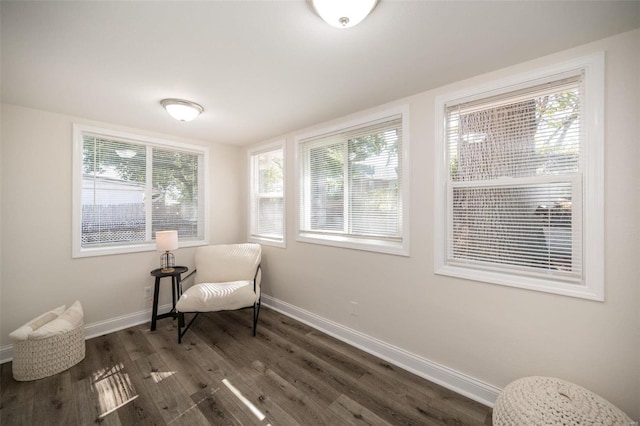 sitting room featuring dark wood-style floors and baseboards