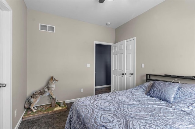 bedroom with a ceiling fan, carpet, visible vents, and baseboards