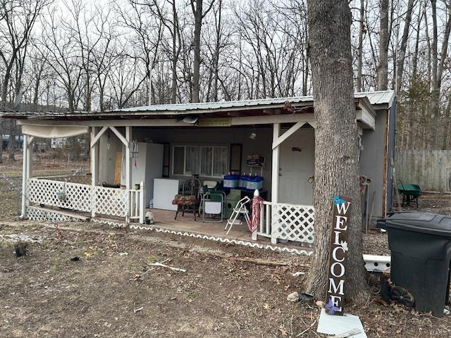 view of outdoor structure featuring a porch