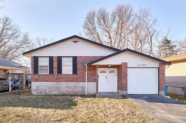 view of front of property with a garage, a front yard, aphalt driveway, and brick siding