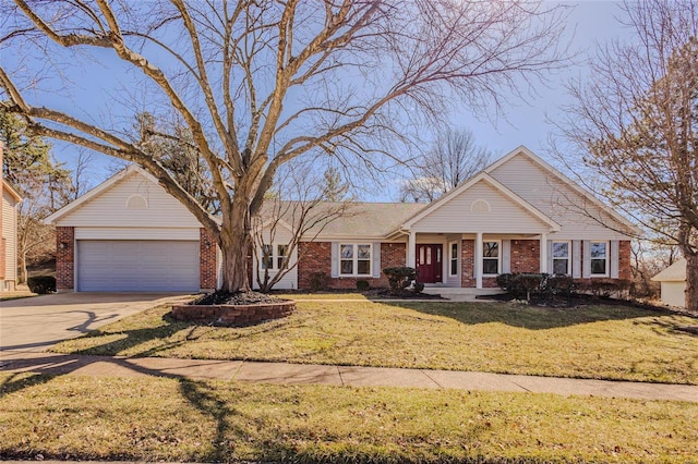 view of front of home featuring a garage, brick siding, driveway, and a front lawn