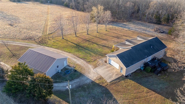 birds eye view of property with a rural view