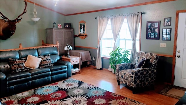 living room featuring wood finished floors and crown molding