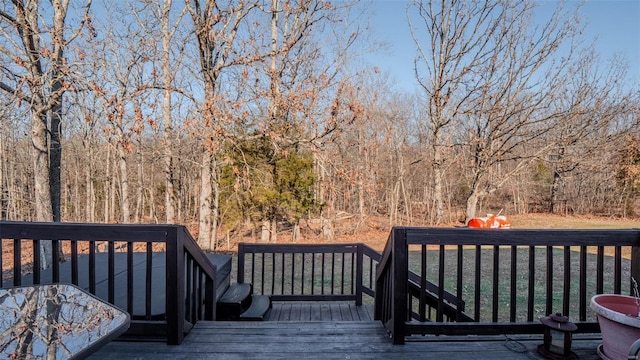 deck featuring a view of trees