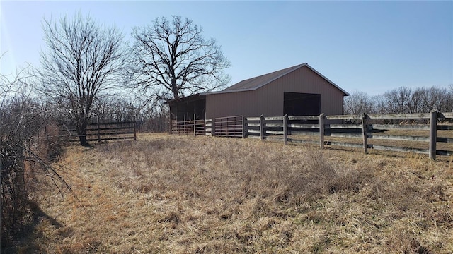 view of horse barn featuring a rural view