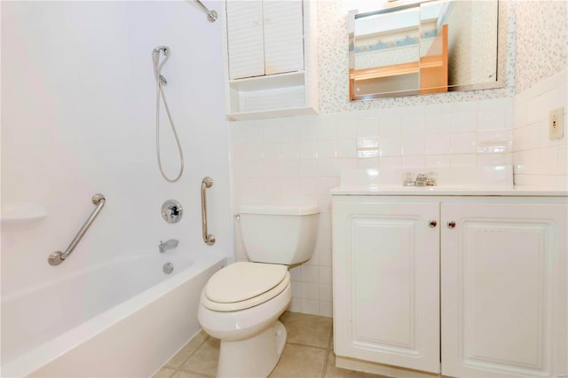 bathroom with tile walls, toilet, vanity, shower / tub combination, and tile patterned flooring