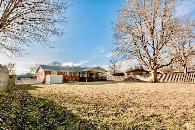 view of yard with a fenced backyard