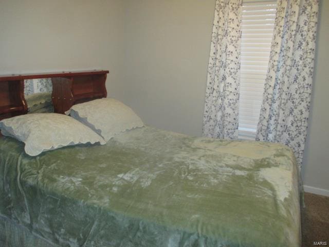 bedroom featuring carpet