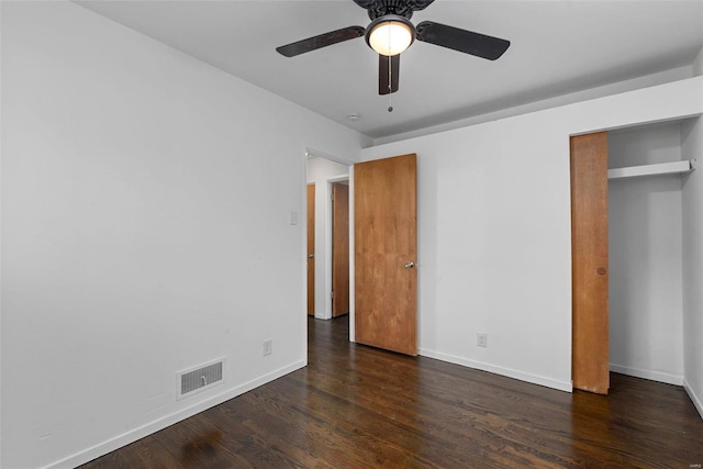 unfurnished bedroom with a ceiling fan, baseboards, visible vents, and wood finished floors