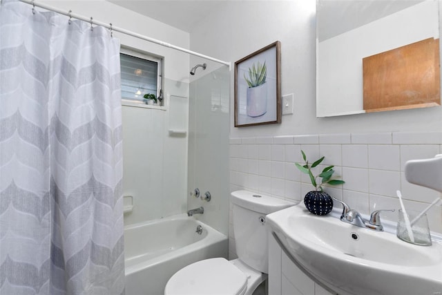 full bathroom with wainscoting, toilet, shower / tub combo with curtain, vanity, and tile walls