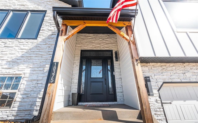 entrance to property with stone siding