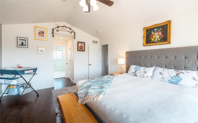 bedroom featuring lofted ceiling, wood finished floors, a ceiling fan, visible vents, and baseboards