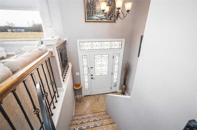 entrance foyer featuring a notable chandelier