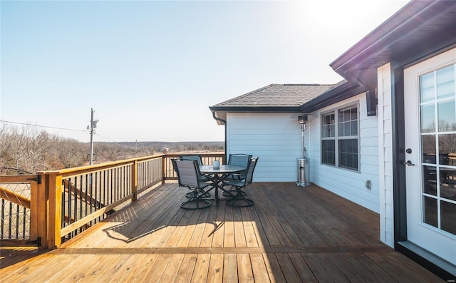 deck featuring outdoor dining area