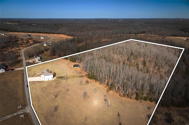 birds eye view of property with a rural view