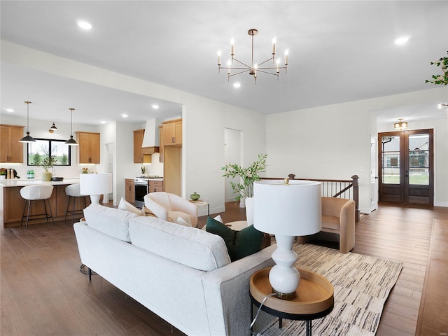 living room featuring recessed lighting, french doors, and wood finished floors