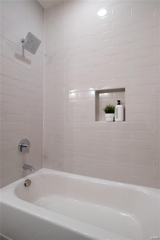 bathroom with shower / tub combination