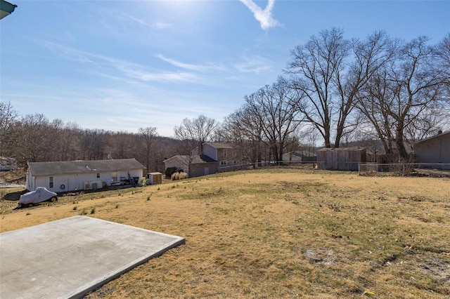 view of yard featuring fence and a patio