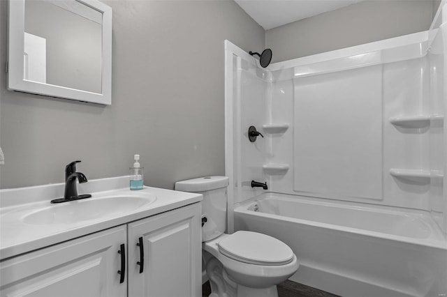 bathroom with vanity, toilet, and shower / bathtub combination