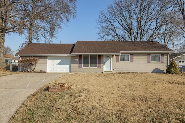 ranch-style house featuring an attached garage, a shingled roof, fence, driveway, and a front lawn