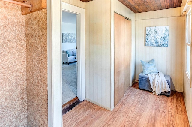 interior space featuring wood finished floors and wood ceiling