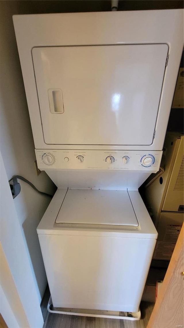 washroom featuring laundry area and stacked washer and clothes dryer