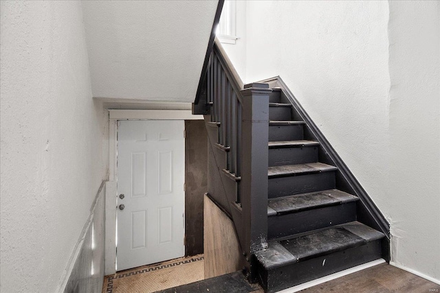 stairway with a textured wall