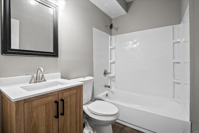 bathroom featuring shower / tub combination, vanity, toilet, and wood finished floors