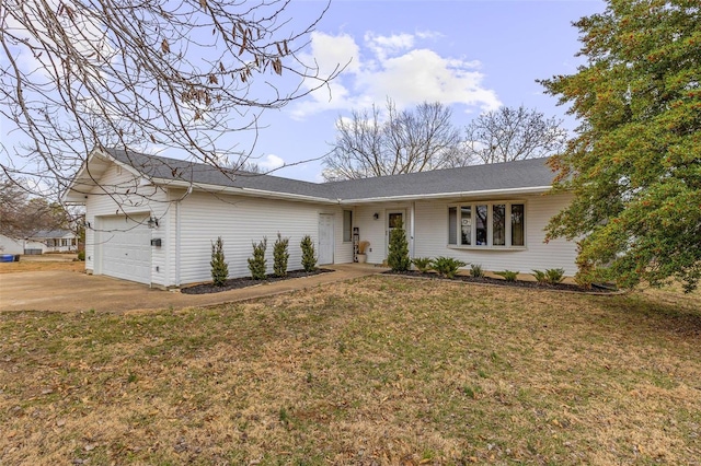 ranch-style home featuring an attached garage, driveway, and a front lawn