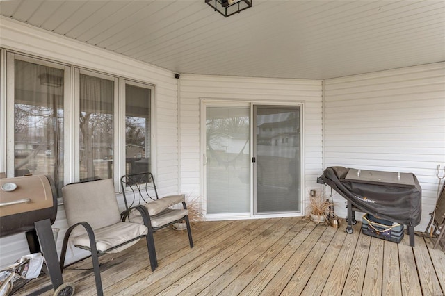 wooden deck featuring area for grilling