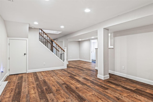 finished basement featuring recessed lighting, stairway, baseboards, and wood finished floors