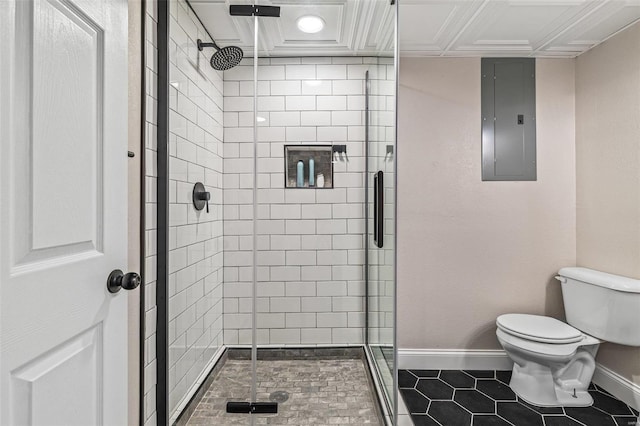 full bathroom featuring a stall shower, baseboards, electric panel, and toilet